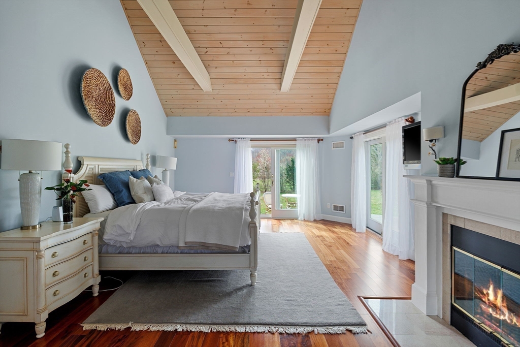 52 Pineswamp Road Ipswich, MA 01938 - Photo 14 of 41 a bedroom with bed and a large window