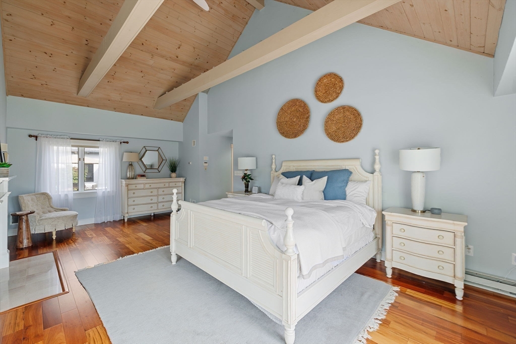 52 Pineswamp Road Ipswich, MA 01938 - Photo 15 of 41 a bedroom with a bed and painting on the wall