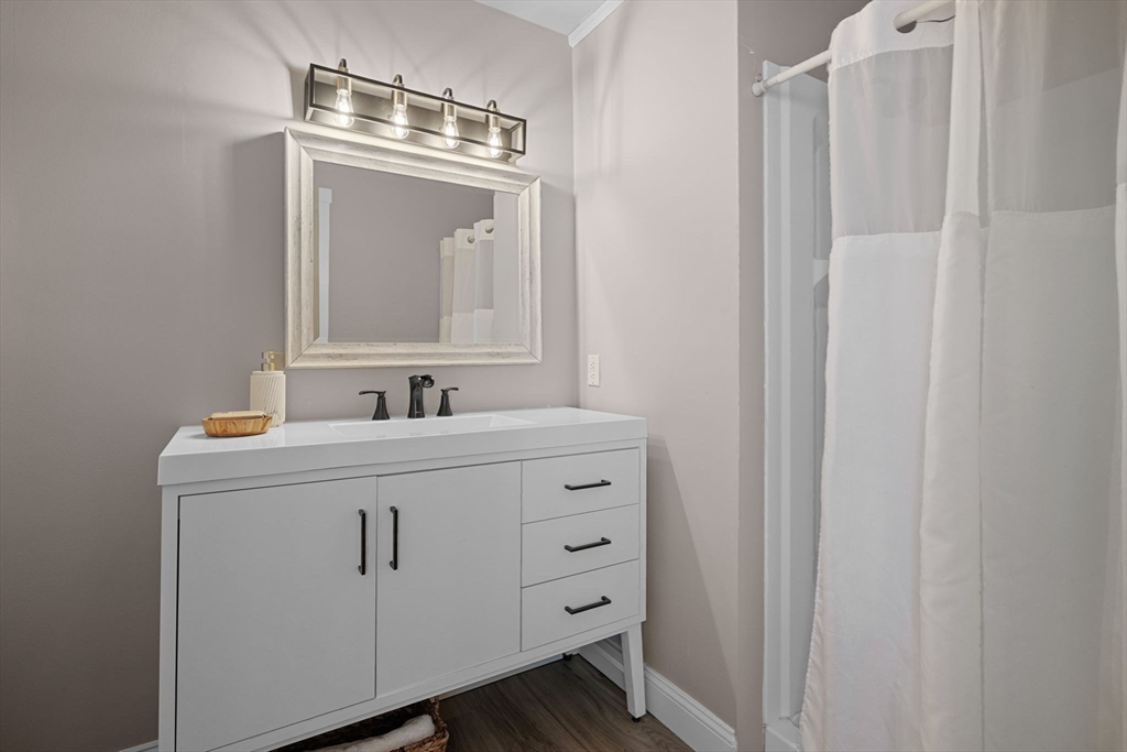 52 Pineswamp Road Ipswich, MA 01938 - Photo 18 of 41 a bathroom with a sink vanity and a mirror