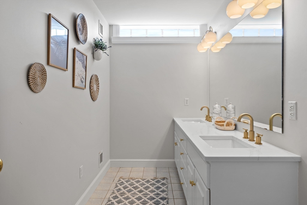 52 Pineswamp Road Ipswich, MA 01938 - Photo 20 of 41 a bathroom with a sink a vanity and a mirror