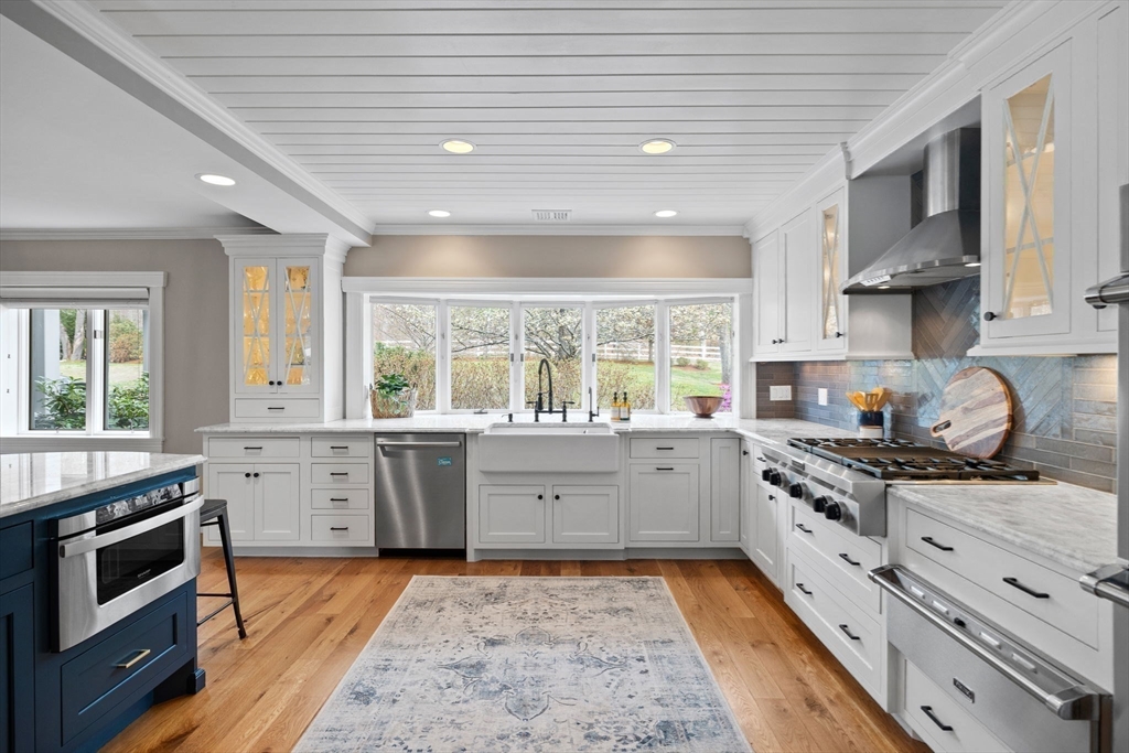52 Pineswamp Road Ipswich, MA 01938 - Photo 2 of 41 a kitchen with a stove sink and cabinets