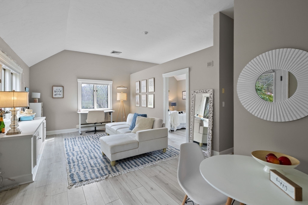 52 Pineswamp Road Ipswich, MA 01938 - Photo 22 of 41 a living room with furniture and a wooden floor