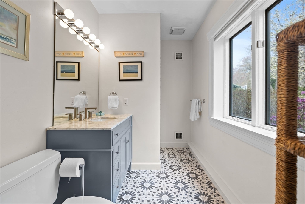 52 Pineswamp Road Ipswich, MA 01938 - Photo 24 of 41 a bathroom with a sink a toilet and a mirror