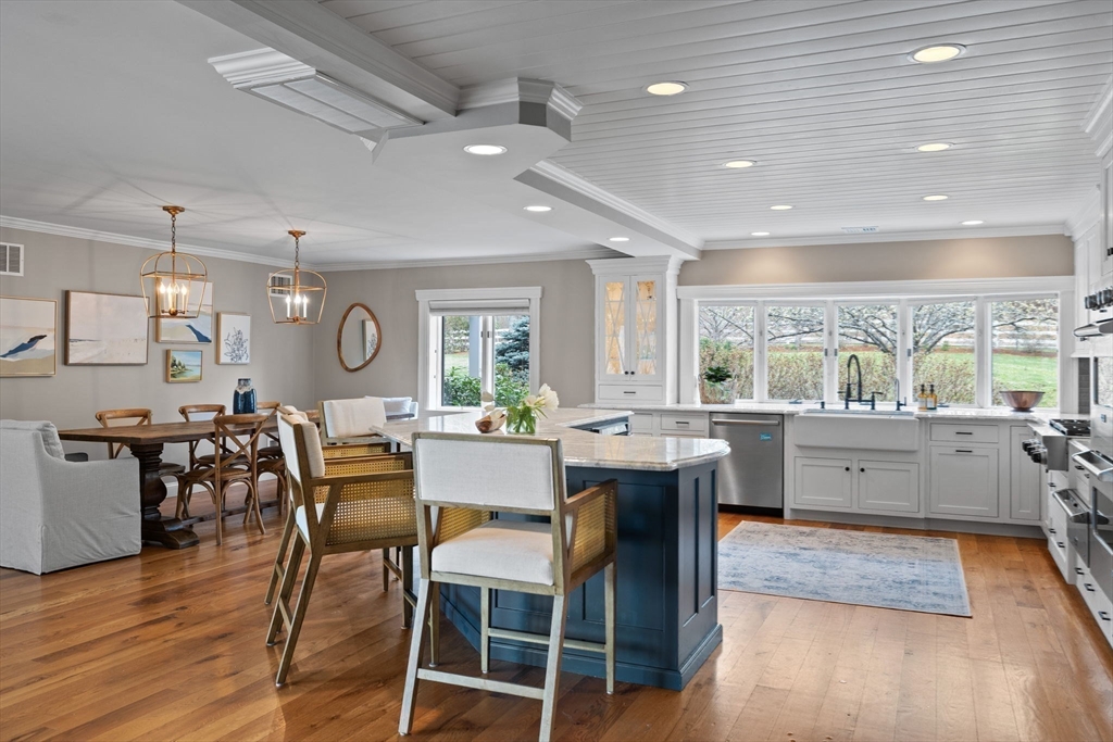 52 Pineswamp Road Ipswich, MA 01938 - Photo 3 of 41 a kitchen with lots of counter top space and dining table