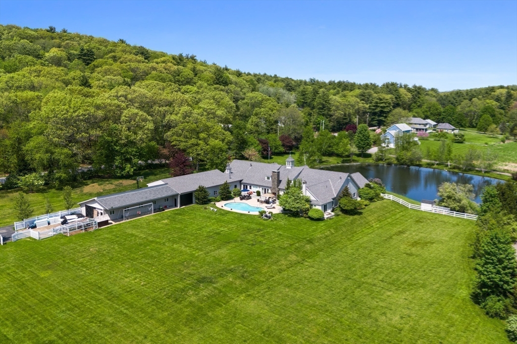 52 Pineswamp Road Ipswich, MA 01938 - Photo 31 of 41 a view of a lake with a yard