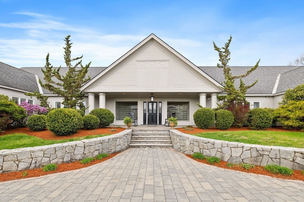 52 Pineswamp Road Ipswich, MA 01938 - Photo 36 of 41 a front view of a house with a yard and potted plants