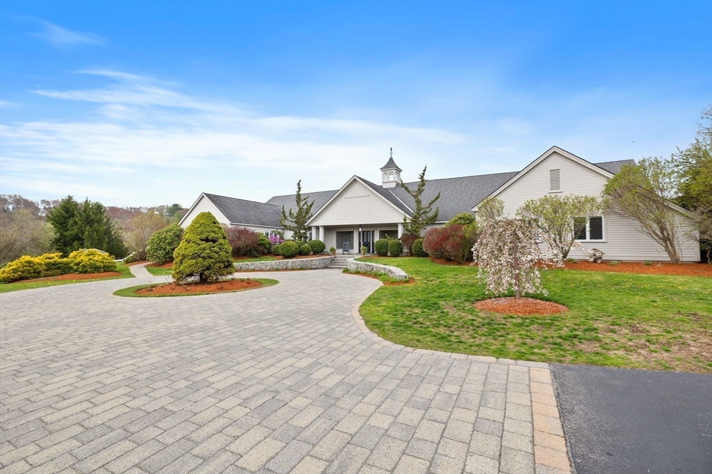 52 Pineswamp Road Ipswich, MA 01938 - Photo 37 of 41 a house with lots of trees in the background