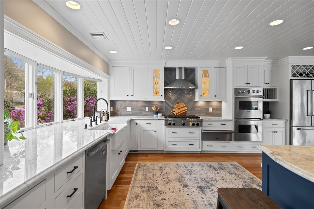 52 Pineswamp Road Ipswich, MA 01938 - Photo 4 of 41 a kitchen with stainless steel appliances kitchen island granite countertop a sink stove and refrigerator