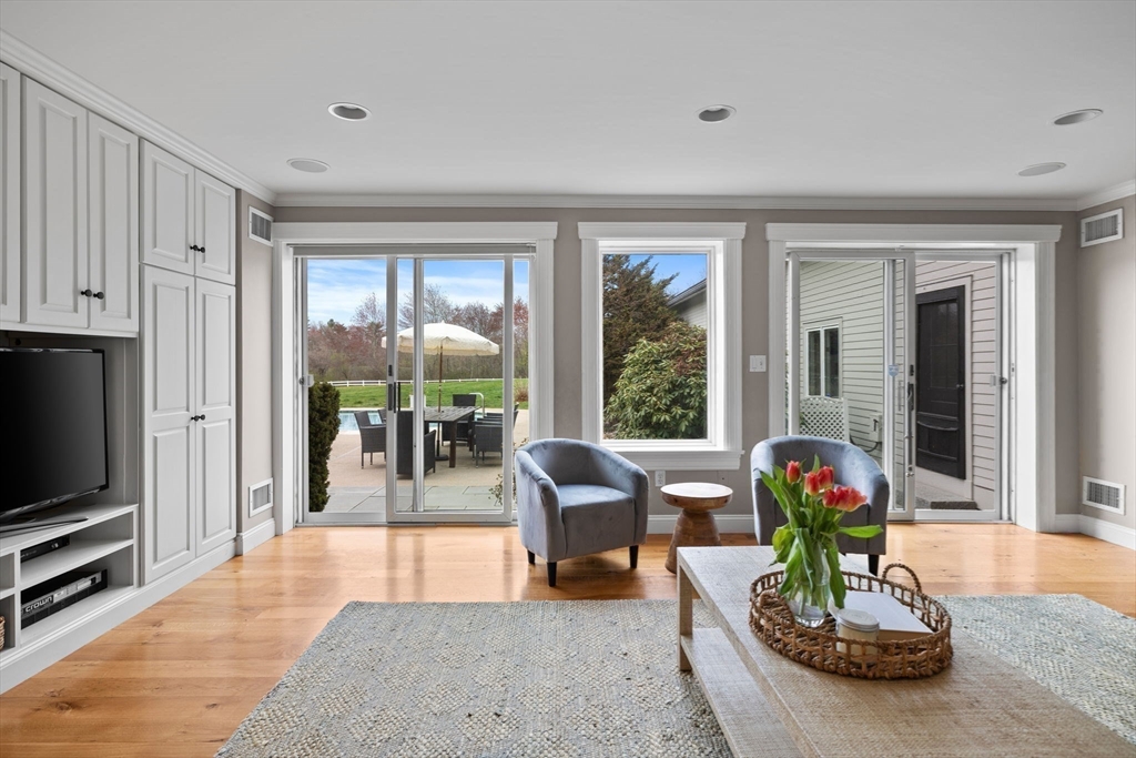 52 Pineswamp Road Ipswich, MA 01938 - Photo 6 of 41 a living room with furniture potted plant and a flat screen tv