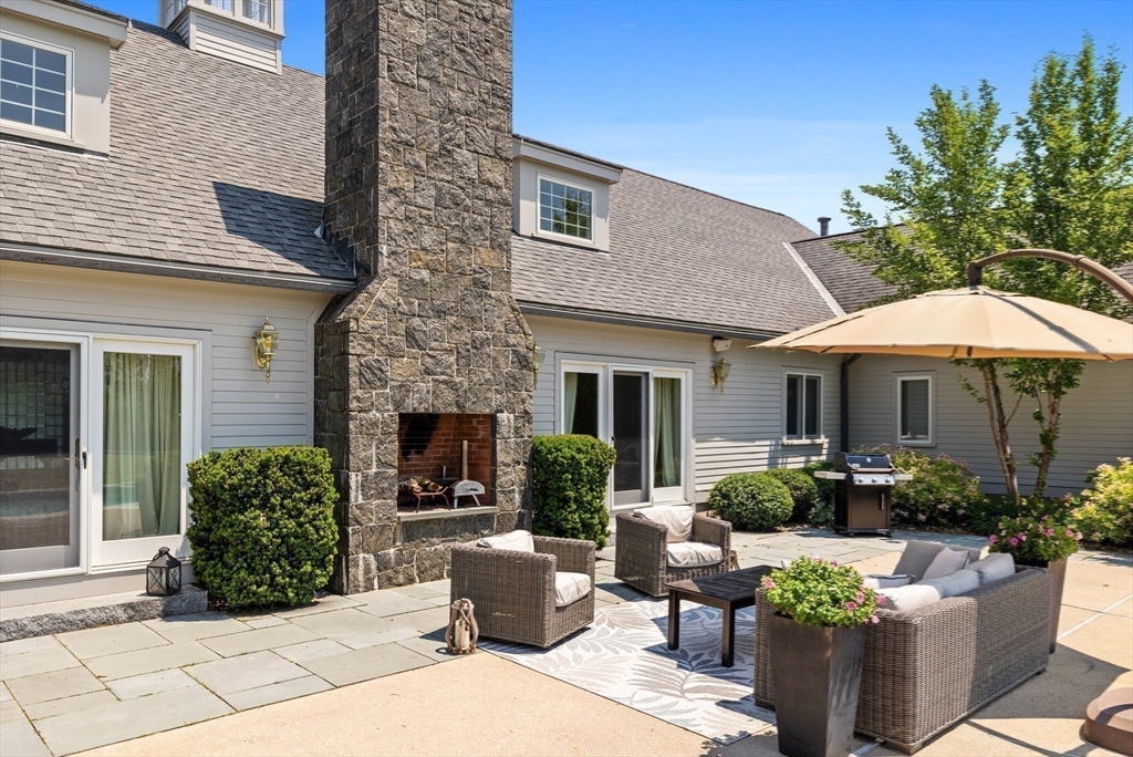 52 Pineswamp Road Ipswich, MA 01938 - Photo 7 of 41 a view of a house with backyard sitting area and furniture
