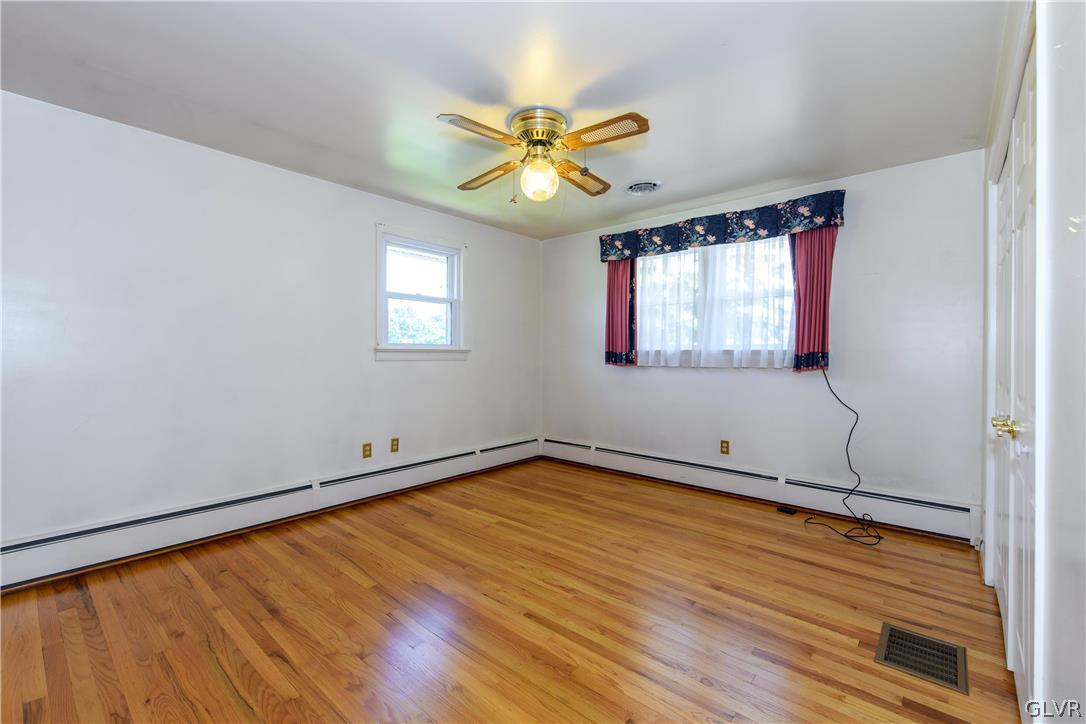 405 Moorestown Drive Bath, PA 18014 - Photo 16 of 50 a view of an empty room with wooden floor and a window