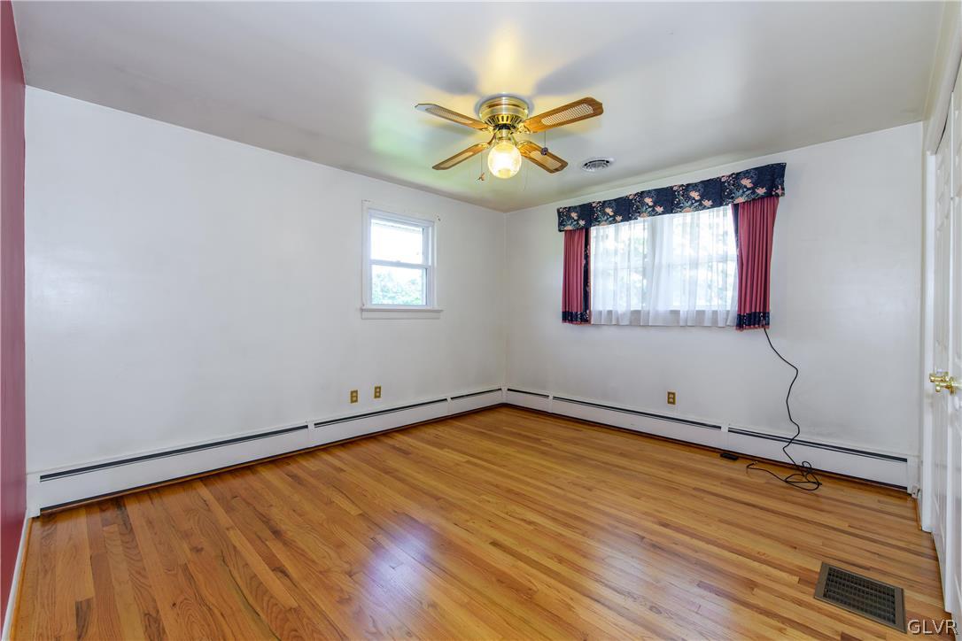 405 Moorestown Drive Bath, PA 18014 - Photo 17 of 50 a view of an empty room with wooden floor and a window