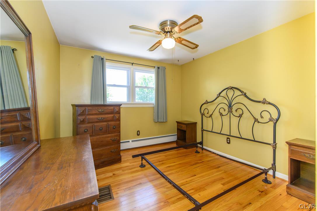405 Moorestown Drive Bath, PA 18014 - Photo 18 of 50 a living room with a bed and a flat screen tv