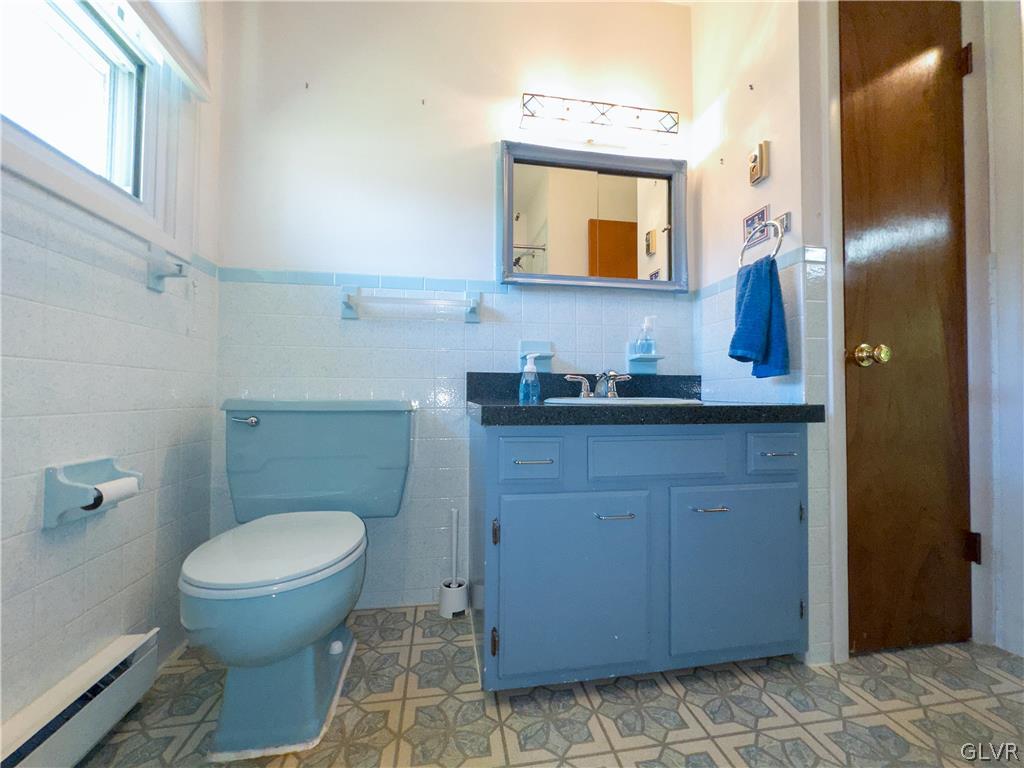 405 Moorestown Drive Bath, PA 18014 - Photo 27 of 50 a bathroom with a granite countertop toilet sink and mirror