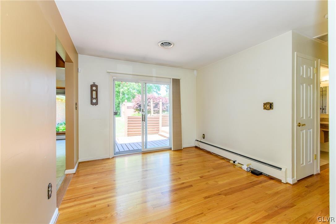 405 Moorestown Drive Bath, PA 18014 - Photo 7 of 50 a view of an empty room with wooden floor and a window