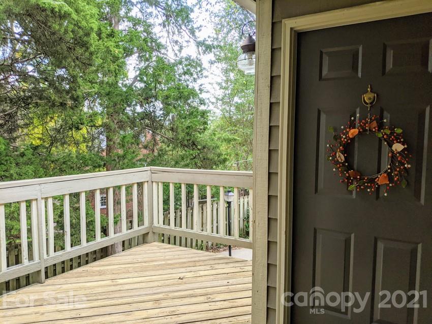 1608 Sharon Road West, Unit 48 Charlotte, NC 28210 - Photo 2 of 15 a balcony with wooden floor