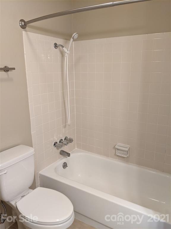 1608 Sharon Road West, Unit 48 Charlotte, NC 28210 - Photo 12 of 15 a bathroom with a toilet and a bathtub