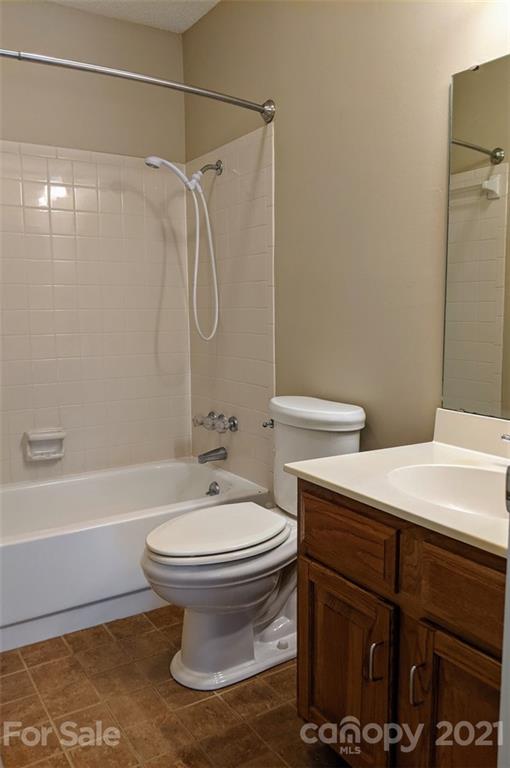 1608 Sharon Road West, Unit 48 Charlotte, NC 28210 - Photo 14 of 15 a bathroom with a sink toilet and shower