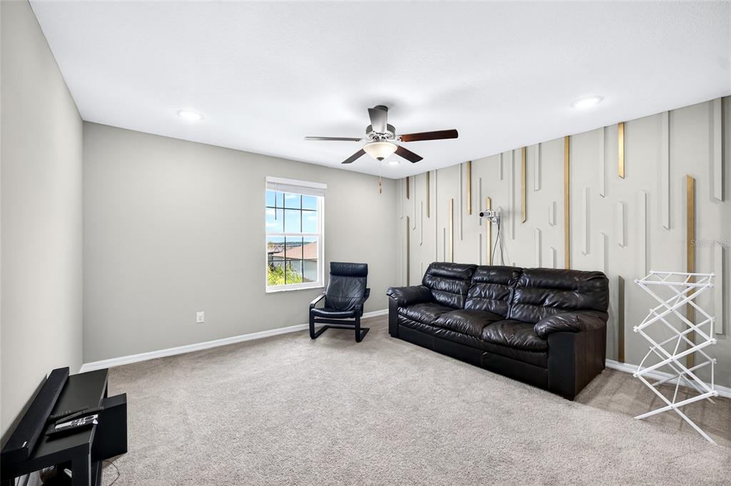 31724 Sun Kettle Loop Wesley Chapel, FL 33545 - Photo 25 of 49 a living room with furniture and a window