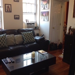11 Phillips Street, Unit 5 Boston, MA 02114 - Photo 2 of 17 a living room with furniture and a window