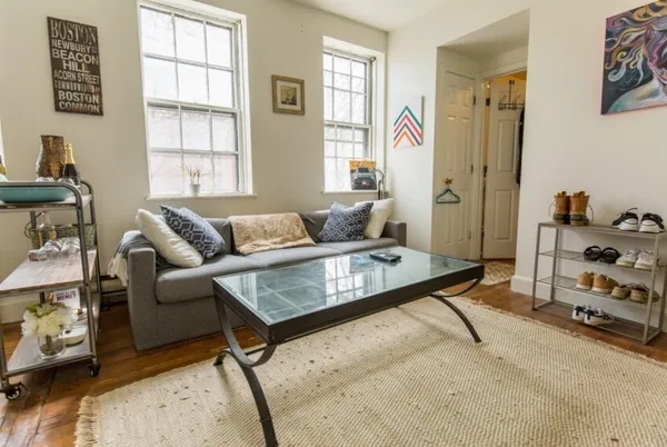 a living room with furniture and a window
