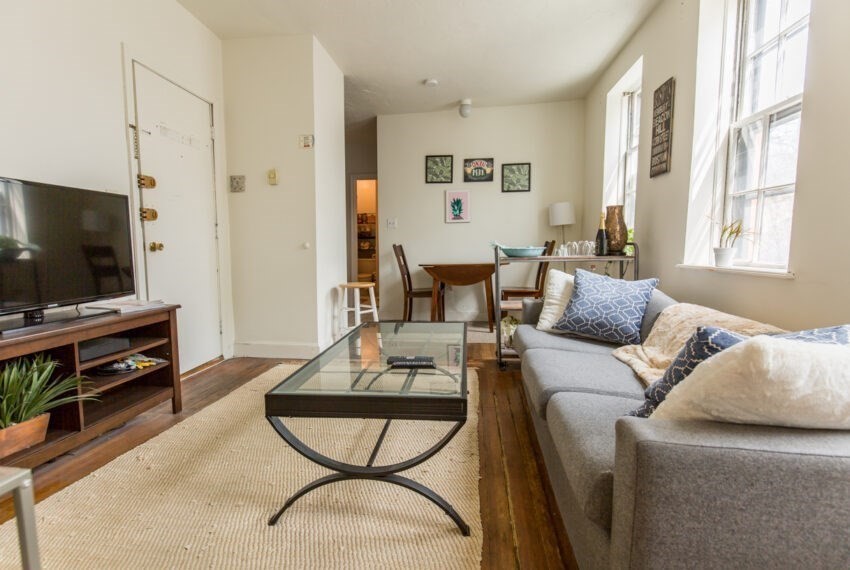 11 Phillips Street, Unit 5 Boston, MA 02114 - Photo 10 of 17 a living room with furniture and a flat screen tv