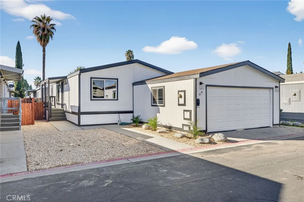 a view of a house with snow on the road