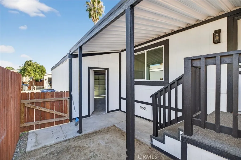 80 Dawes, Unit 88 Perris, CA 92571 - Photo 19 of 29 a view of staircase with railing and white walls