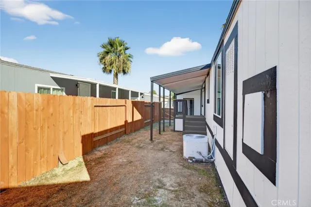 a porch with a table and chairs