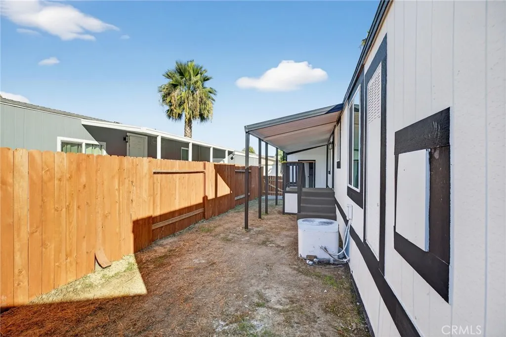 80 Dawes, Unit 88 Perris, CA 92571 - Photo 21 of 29 a porch with a table and chairs