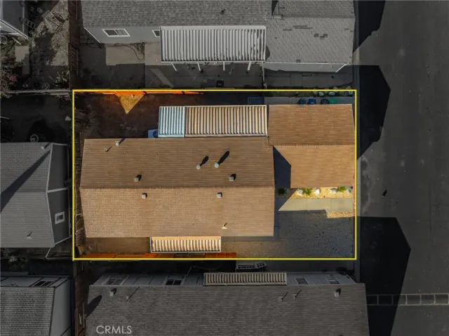 an aerial view of a residential houses with outdoor space