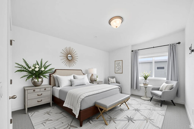 7713 Navarro View Court Midvale, UT 84047 - Photo 14 of 41 Carpeted bedroom featuring a window with natural light, a ceiling-mounted light fixture, and neutral wall tones