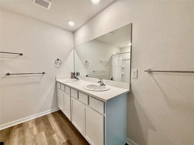 a kitchen with a sink and a refrigerator