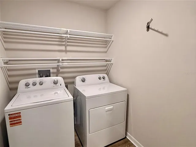 a utility room with dryer and washer