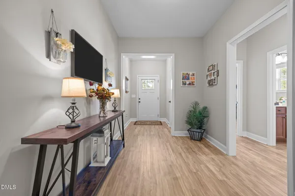 a living room with furniture fireplace and flat screen tv