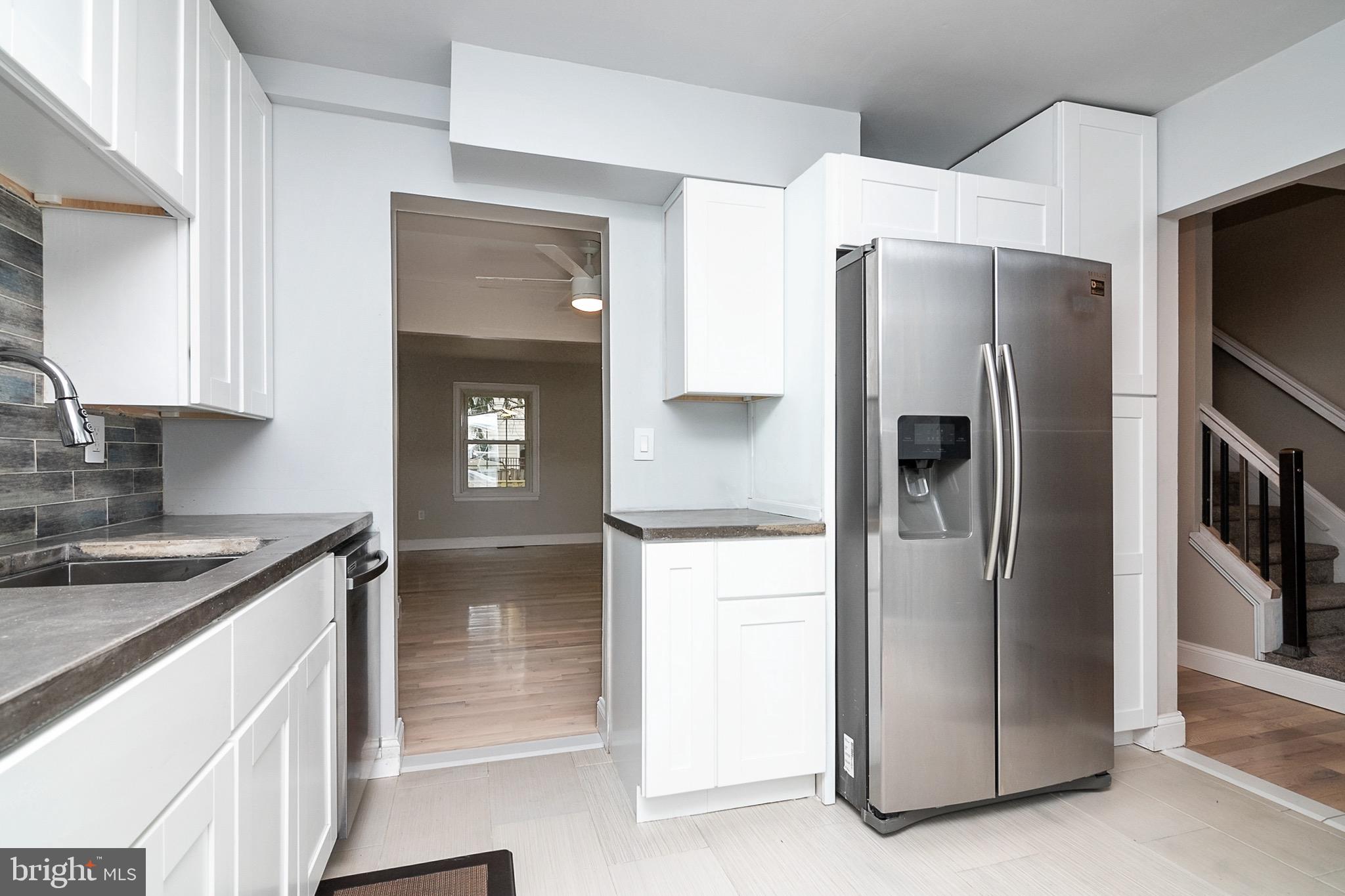 5974 Grand Banks Road Columbia, MD 21044 - Photo 15 of 36 Shaker cabinets and trendy concrete counters