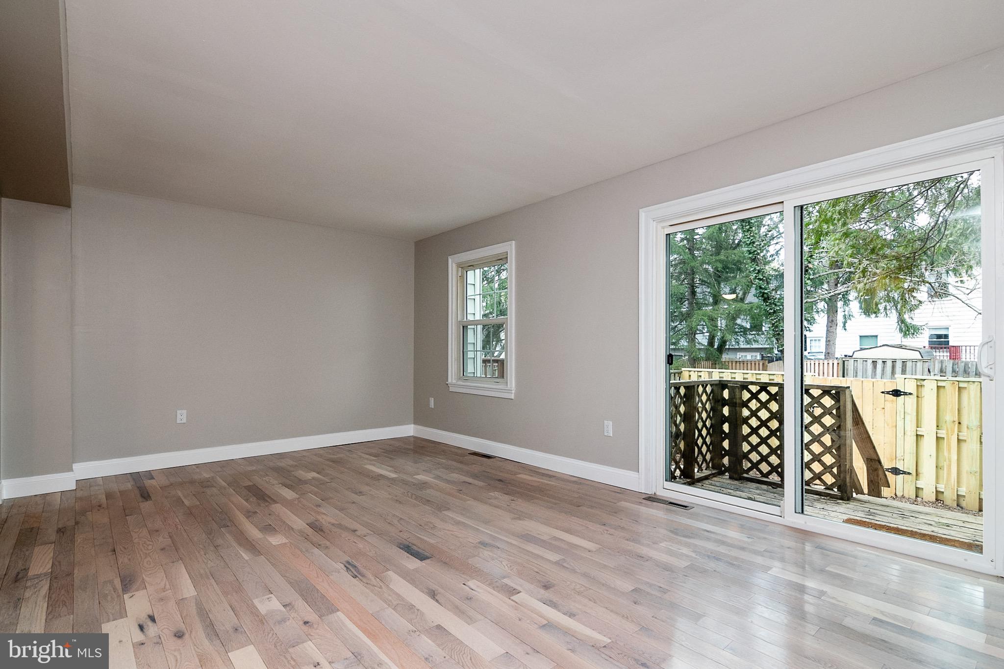 5974 Grand Banks Road Columbia, MD 21044 - Photo 9 of 36 Living room with view to fenced back yard