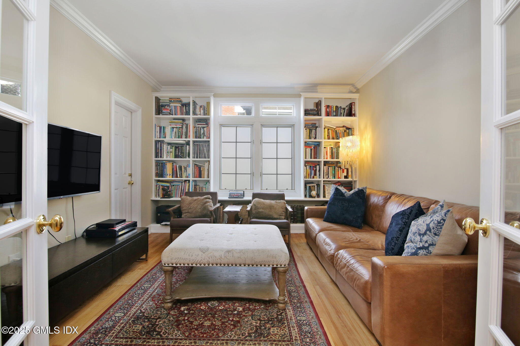 73 Weaver Street, Unit 4 Greenwich, CT 06831 - Photo 11 of 30 a living room with furniture and a flat screen tv