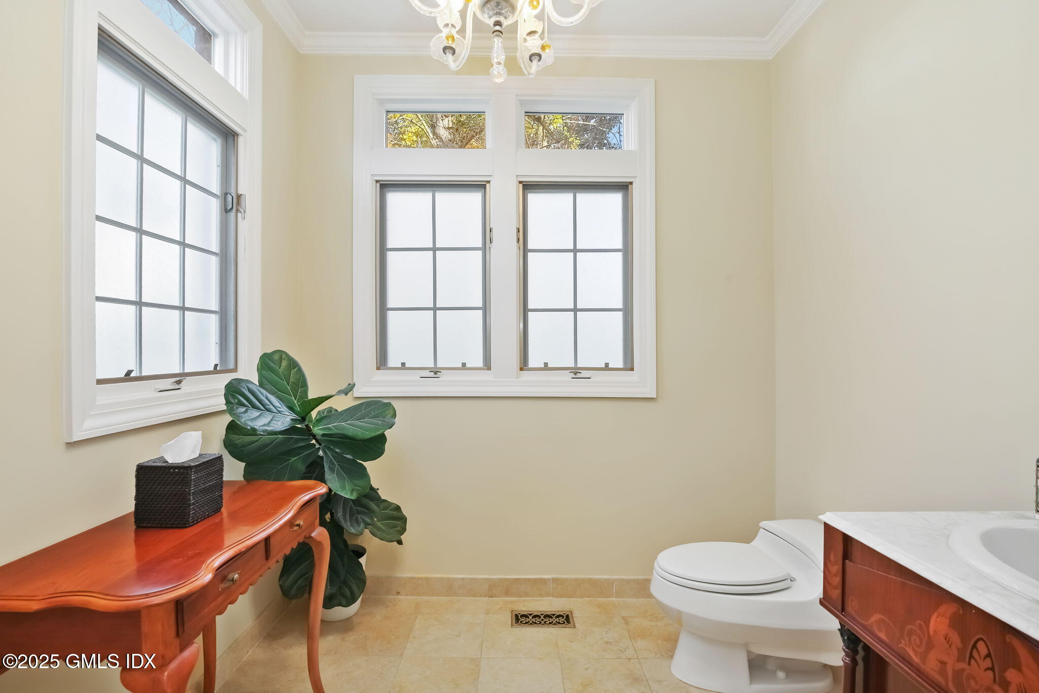 73 Weaver Street, Unit 4 Greenwich, CT 06831 - Photo 12 of 30 a bath room with a window and a potted plant