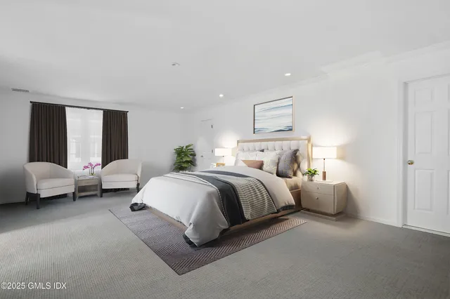 a spacious bedroom with a bed and window