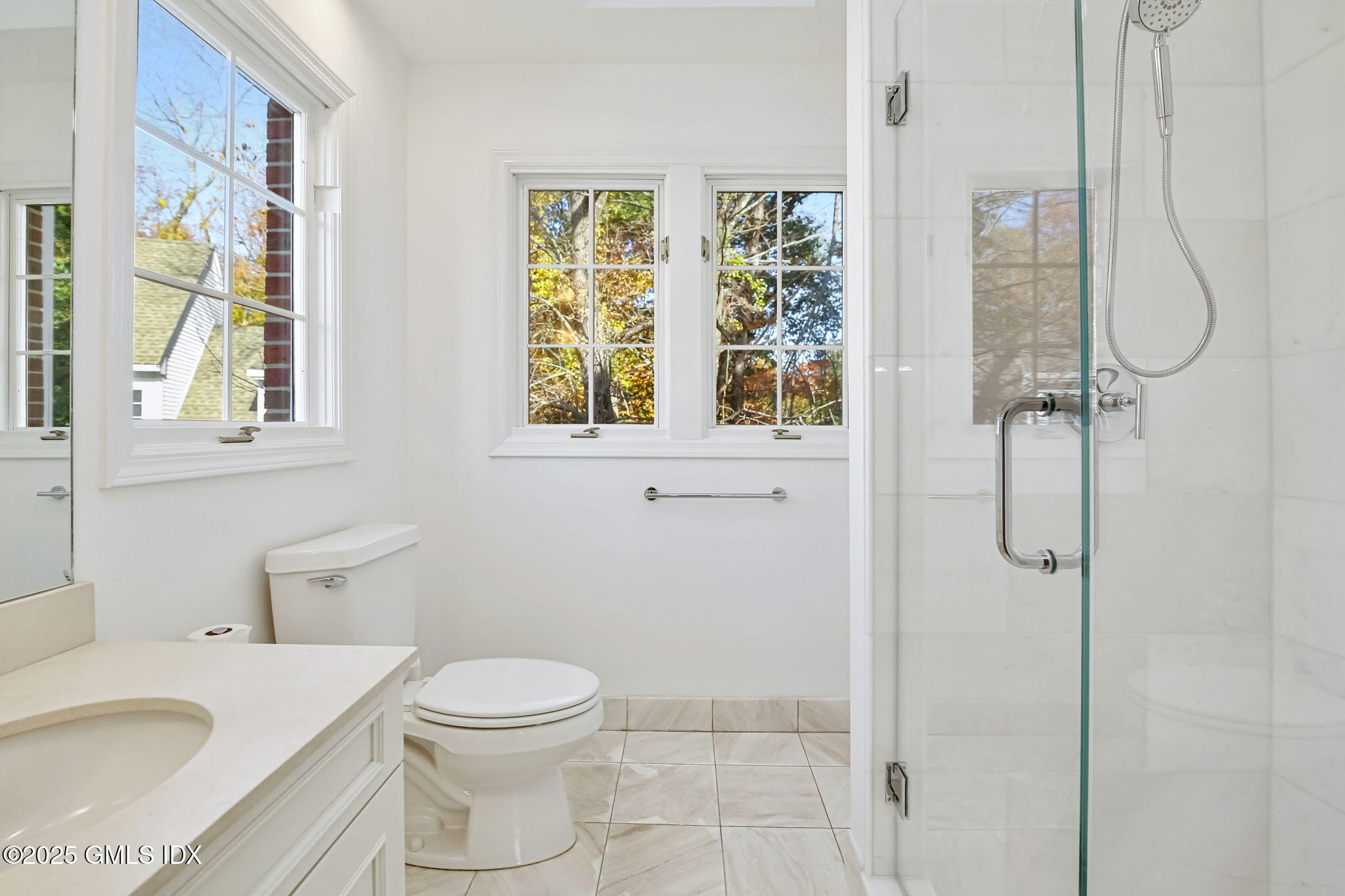 73 Weaver Street, Unit 4 Greenwich, CT 06831 - Photo 14 of 30 a bathroom with a granite countertop sink toilet and shower