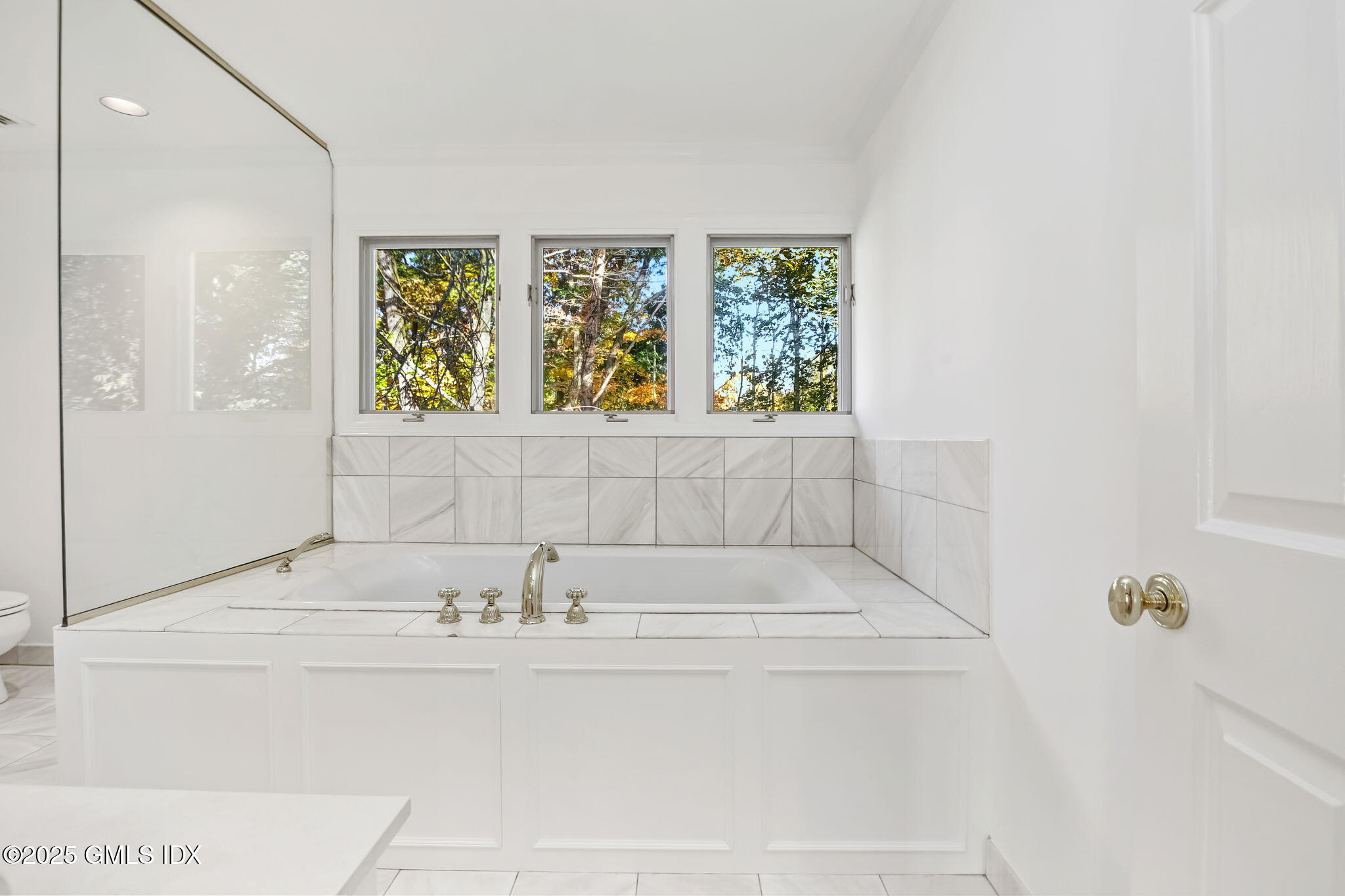 73 Weaver Street, Unit 4 Greenwich, CT 06831 - Photo 15 of 30 a bathroom with a bathtub and window