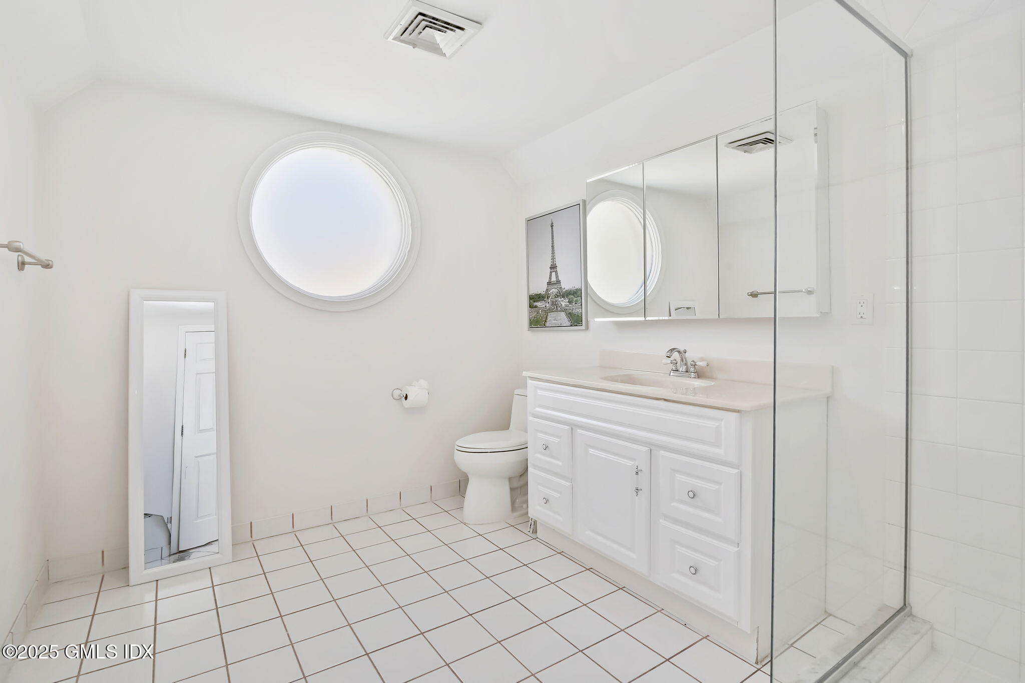 73 Weaver Street, Unit 4 Greenwich, CT 06831 - Photo 20 of 30 a bathroom with a toilet sink and mirror