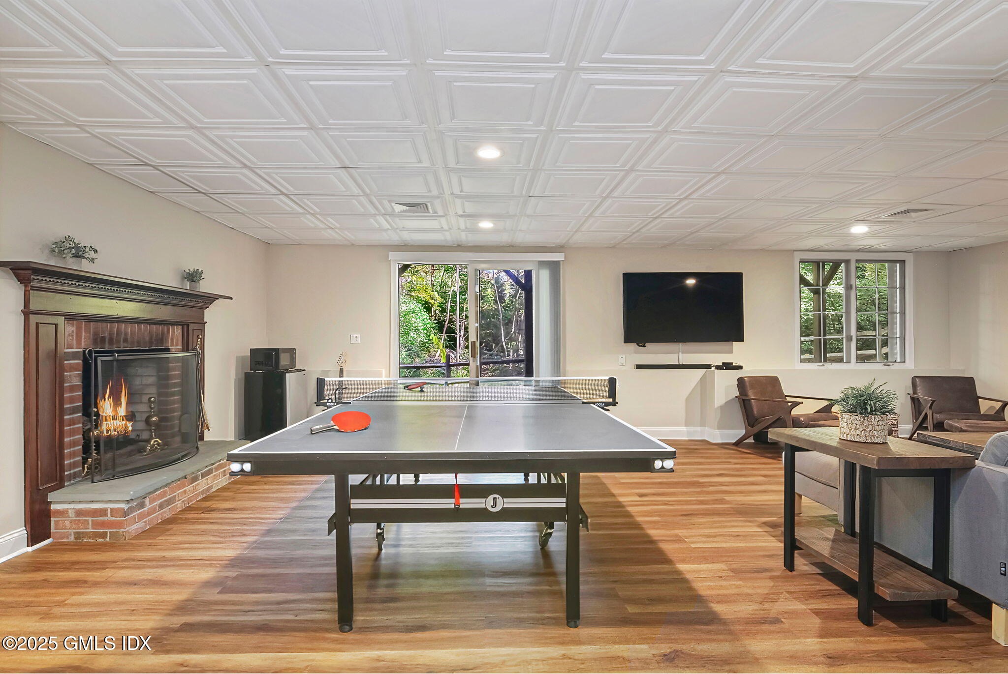 73 Weaver Street, Unit 4 Greenwich, CT 06831 - Photo 22 of 30 a room with pool table and windows