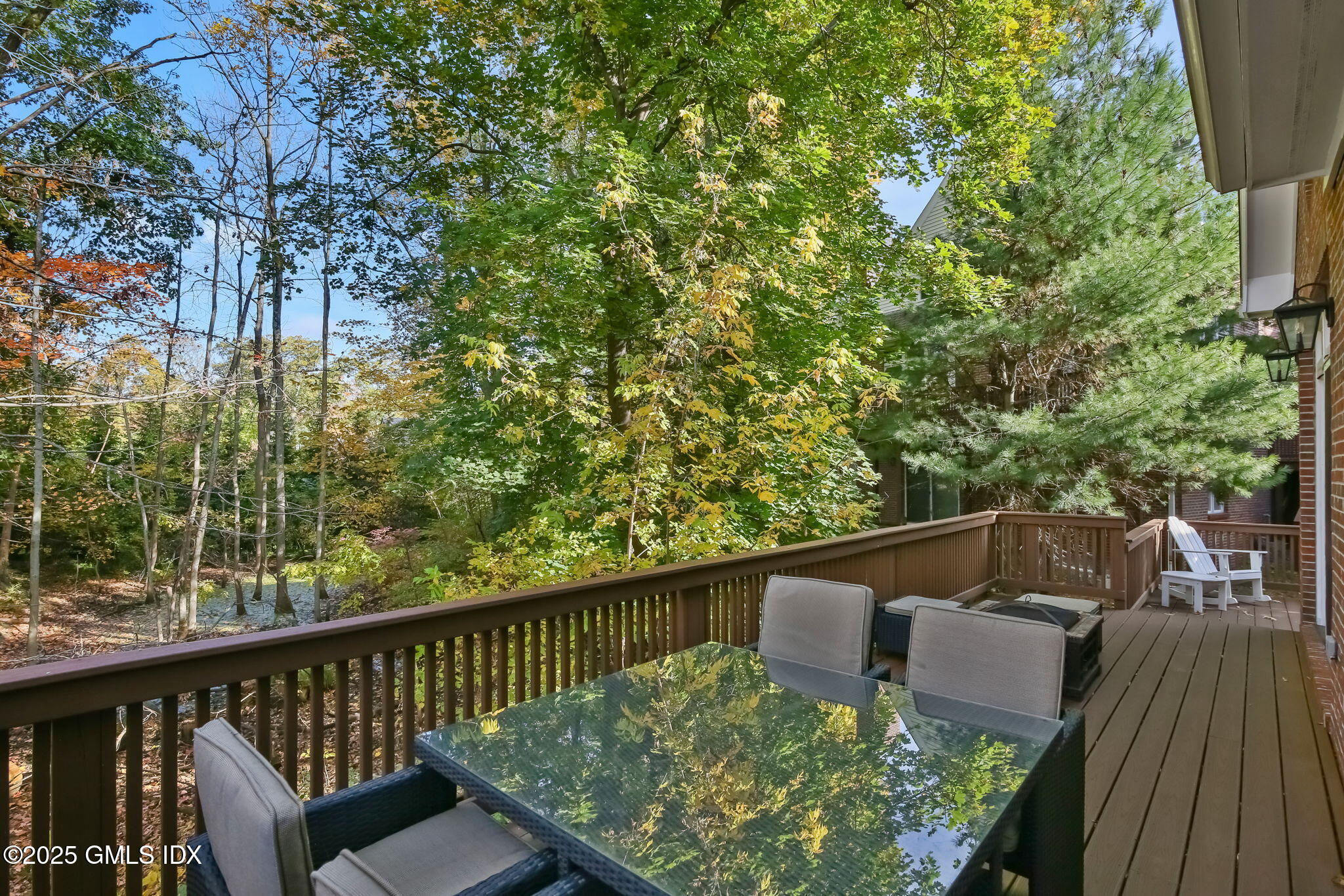 73 Weaver Street, Unit 4 Greenwich, CT 06831 - Photo 25 of 30 a view of a balcony with wooden floor and outdoor seating