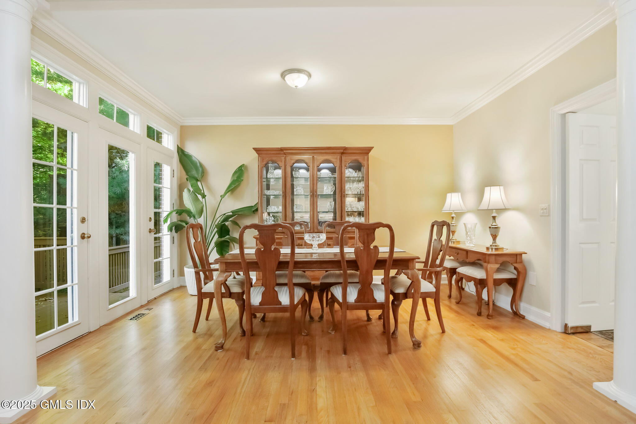 73 Weaver Street, Unit 4 Greenwich, CT 06831 - Photo 8 of 30 a view of a dining room with furniture window and wooden floor