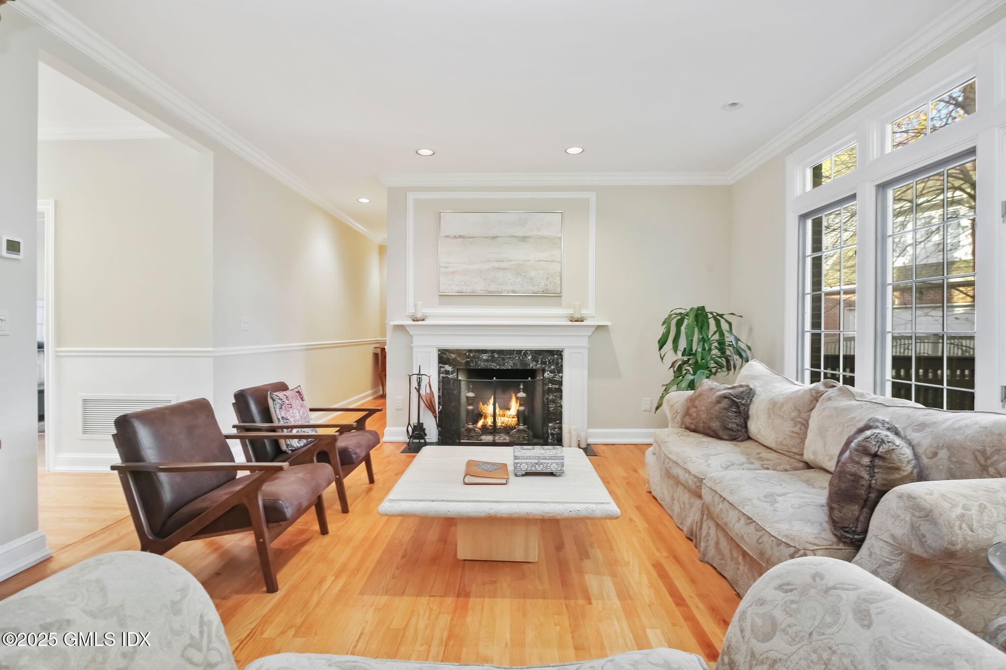 73 Weaver Street, Unit 4 Greenwich, CT 06831 - Photo 9 of 30 a living room with furniture and a fireplace