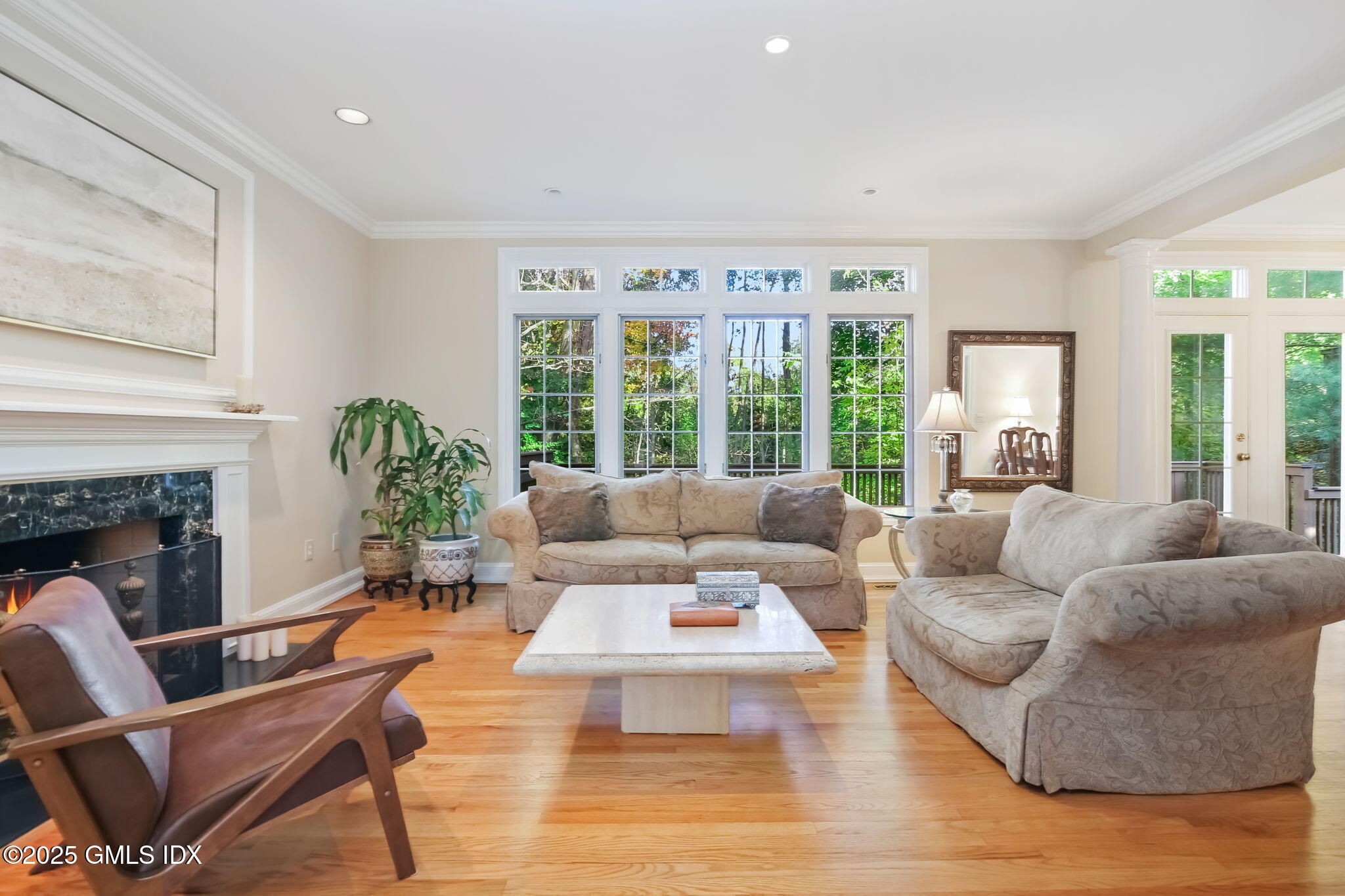 73 Weaver Street, Unit 4 Greenwich, CT 06831 - Photo 10 of 30 a living room with furniture and a fireplace