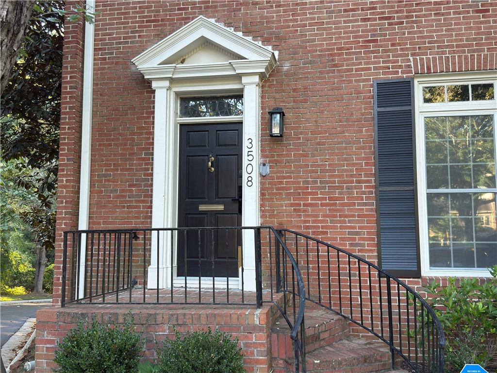 a front view of a house with a fence