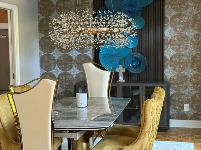 a living room with a couch a fireplace and a flat screen tv